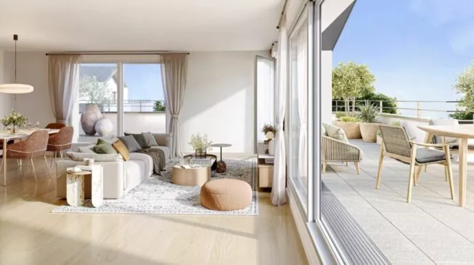 Intérieur et extérieur d'un appartement de la résidence le Garry situé à Châteaubourg, près de Rennes. Un salon et une terrasse exposée au soleil. Logements neufs réalisés par Pierre Promotion.
