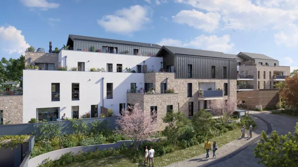 Extérieur de la résidence Le Garry à Châteaubourg, situé près de Rennes. Jardin partagé et façade du bâtiment. Des logements neufs réalisés par Pierre Promotion.