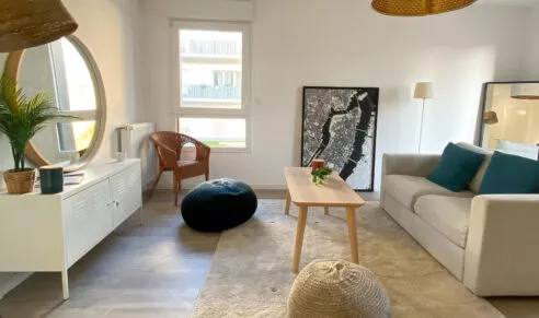 Salon et salle à manger d'un appartement neuf à Rennes, dans la résidence Brownstone.