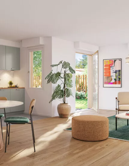 Intérieur d'un appartement lumineux de L'Eclat situé à Ploemeur, près de Lorient. Une cuisine ouverte sur la salle à manger et le salon avec une décoration nature. Des logements neufs réalisés par Pierre Promotion