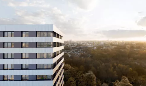 Extérieur du haut du bâtiment Perspectives situé à Saint-Jacques-de-la-Lande, près de Rennes, proposant une belle vue de Rennes. Un ensemble de logements et de cellules commerciales réalisé par Pierre Promotion.