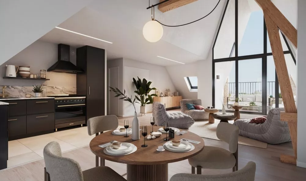 Intérieur d'un appartement de la résidence George V à Saint-Malo, cuisine, salon et salle à manger. Des appartements réalisés par Pierre Promotion.