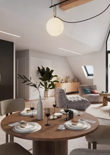 Intérieur d'un appartement de la résidence George V à Saint-Malo, cuisine, salon et salle à manger. Des appartements réalisés par Pierre Promotion.